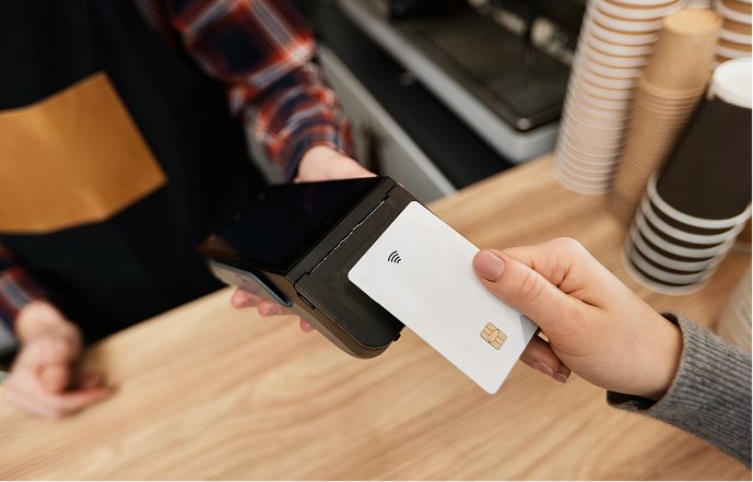 A customer paying by card at the counter