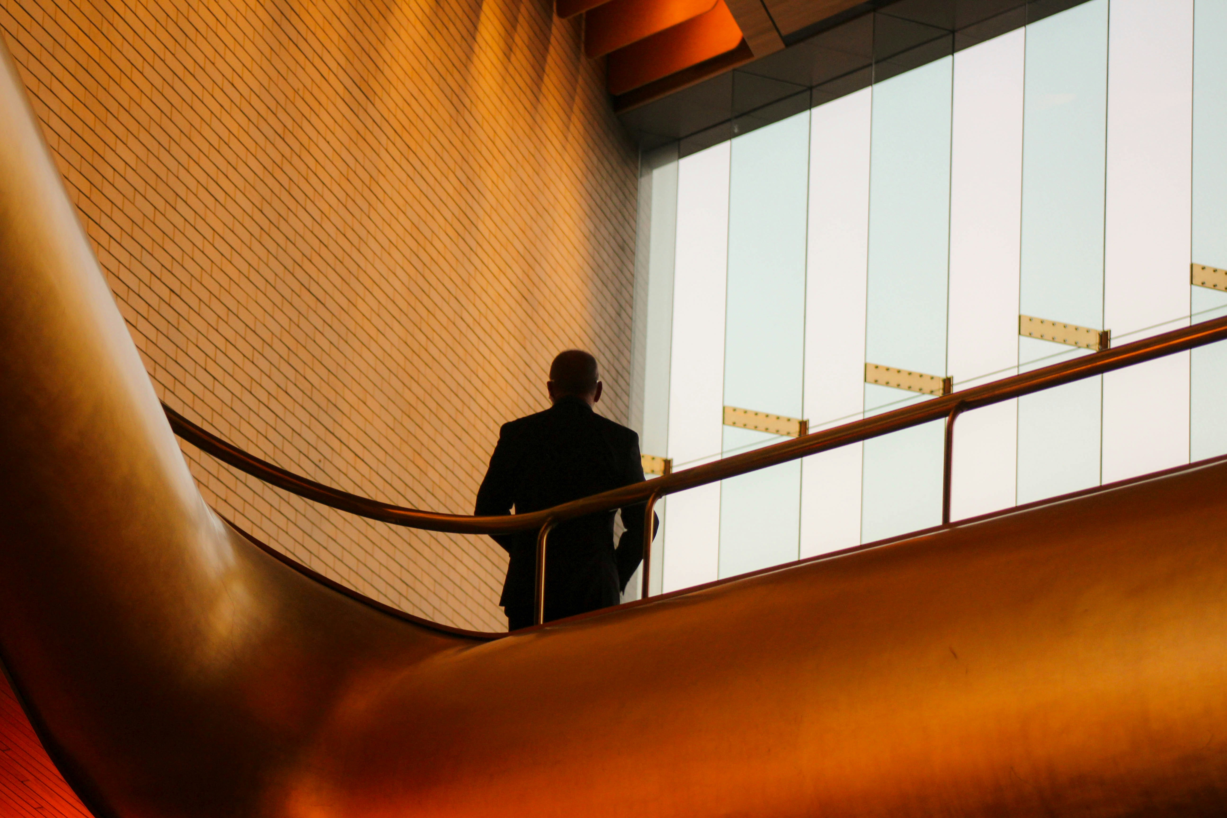Man on an escalator